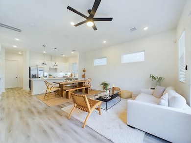 open concept living/dining/kitchen area on the fir