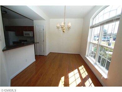 Dining Room - Sunny dining room with hardwood floo