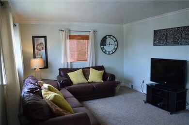 Hardwood floors are under the fresh carpet.