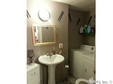 Bathroom. The half bath features fresh paint, pede