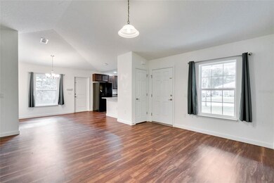 Open floor plan of living room, dining room and ki