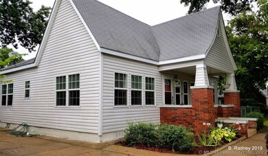 Pretty 20's era bungalow has vintage style with mo