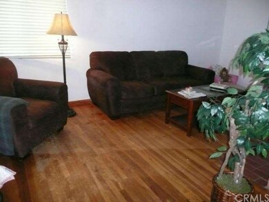 Sunny living room with original hardwood floors