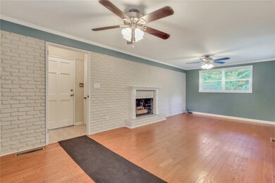 Den, located at carport door.