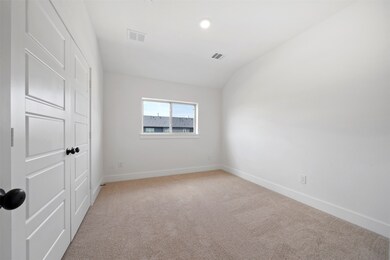 Spare room featuring light carpet, recessed lighting, and lofted ceiling