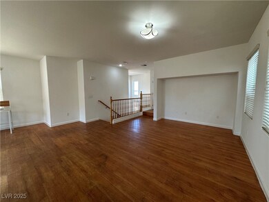 Unfurnished room featuring baseboards and wood fin