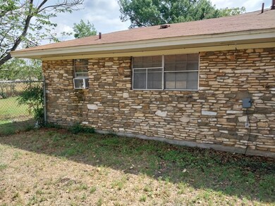 View of home's exterior with cooling unit