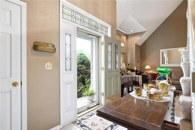 Open to formal living room & formal dining with th