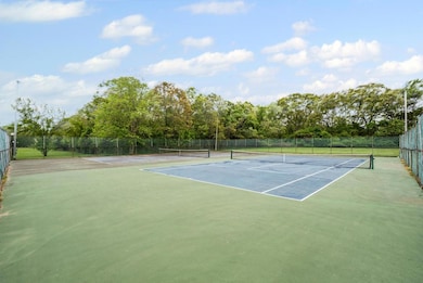View of tennis court with fence