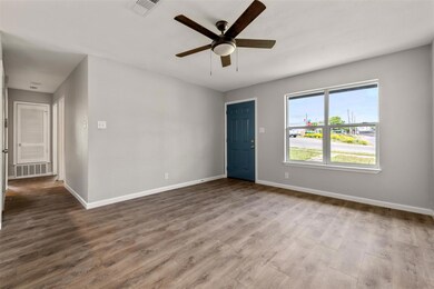 Empty room with wood finished floors and ceiling 