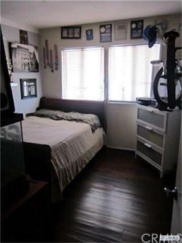 Bedroom 1 with wood flooring