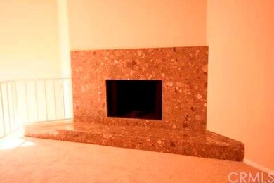 Contemporary fireplace with marble facade.
