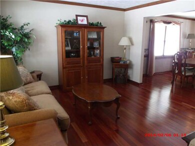Living Room. Hardwood flooring with crown molding 