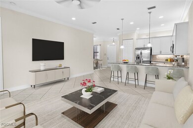 Living area with light tile patterned floors, crown molding, recessed lighting, and a ceiling fan