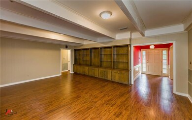 Spacious family room has plenty of built-in displa