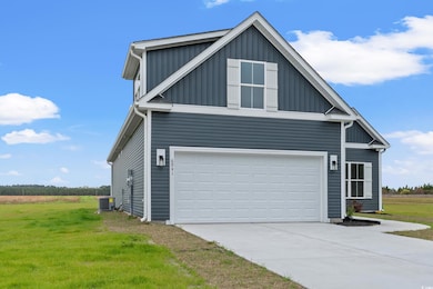 View of side of property featuring central AC, a y