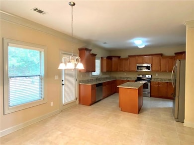 Kitchen featuring appliances with stainless steel 