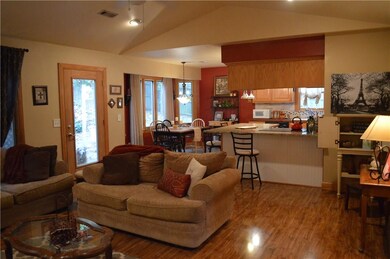 Living room has plenty of windows that allow light