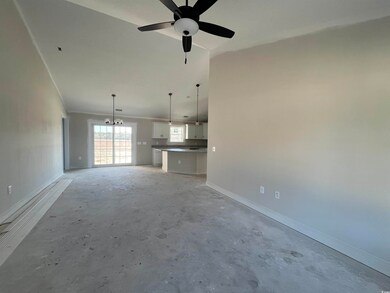 Unfurnished living room with ceiling fan