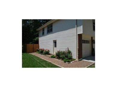 Nice Rose Bushes! Door leads into garage.