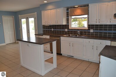 Kitchen with island that includes electrical servi
