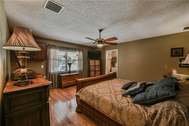 Large Master Bedroom with hardwood floor.