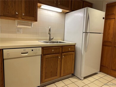 Refrigerator and Bosch Dishwasher in Kitchen with