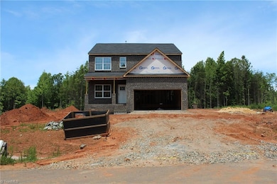 Large Front Yard with Long Concrete Driveway