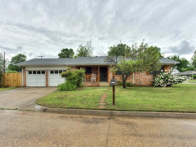 Single story home with covered porch, concrete dri