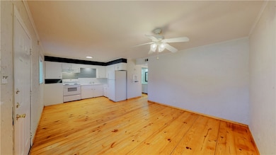 Unfurnished living room featuring light wood finis