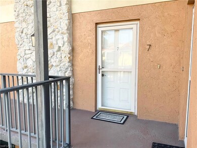 Property entrance with a balcony