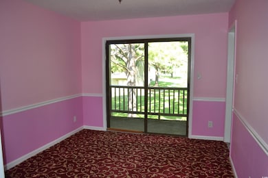 Unfurnished room featuring a textured ceiling