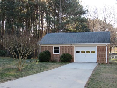 Single car garage and workshop with bath and heat.