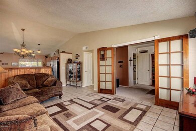 Double Drs leading to Den off Living Rm