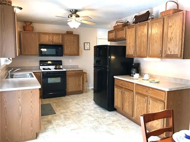 THE LARGE KITCHEN IS ACCENTED BY OPEN SOFFET CABIN