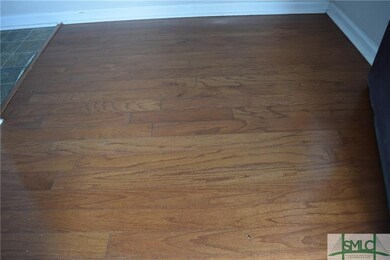 Foyer entranceway has real hardwood floors