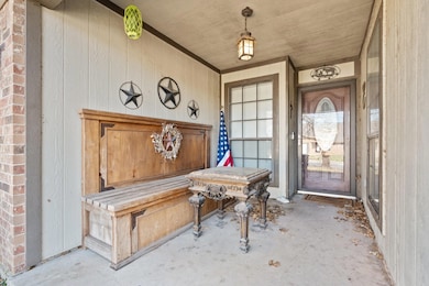 Property entrance featuring brick siding