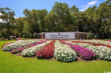 Community sign featuring a lawn