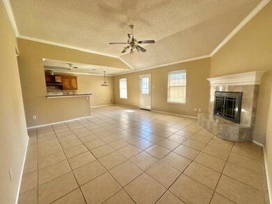 Unfurnished living room featuring a textured ceili