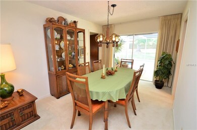 Dining room area with sliding glass doors that lea