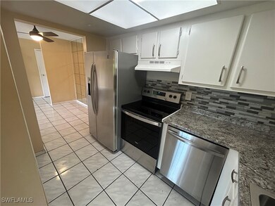 Kitchen featuring appliances with stainless steel