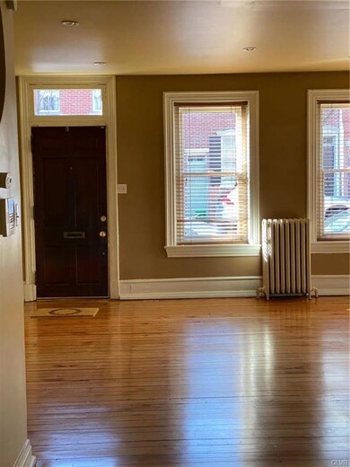 View from Kitchen of front door and windows