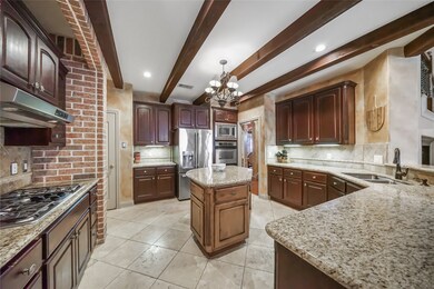 This desirable kitchen has so much countertop space, storage, and double oven.