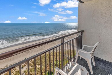 Balcony with a beach view and a water view