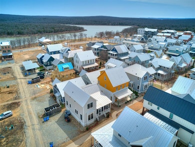 Drone / aerial view featuring a wooded view and a 