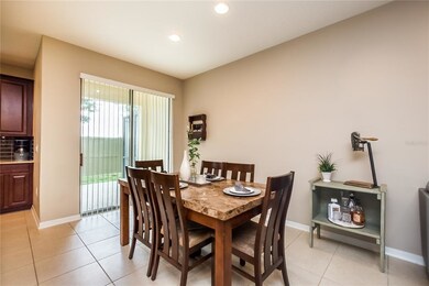 From the dining area, a sliding door opens up to t