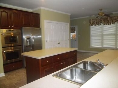View of Kitchen from Great Room.  The pantry is hu