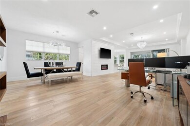 Home office featuring a notable chandelier, plenty