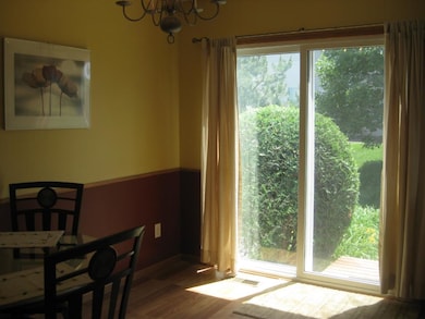 Your eat-in kitchen with patio door access to the 