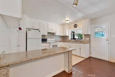 Open Kitchen with Granite Counter Tops and Breakfast Bar